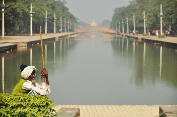 A patient man waiting by the water.