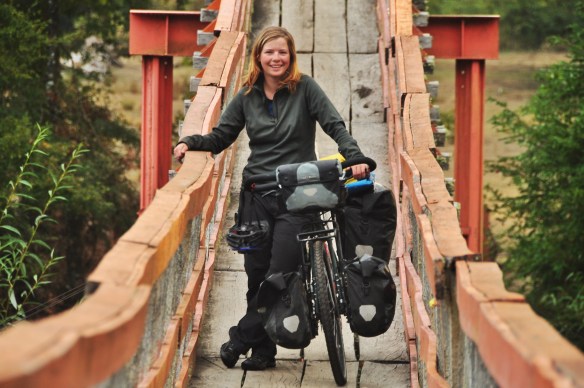 Crossing a rickety bridge to find a field to camp in.