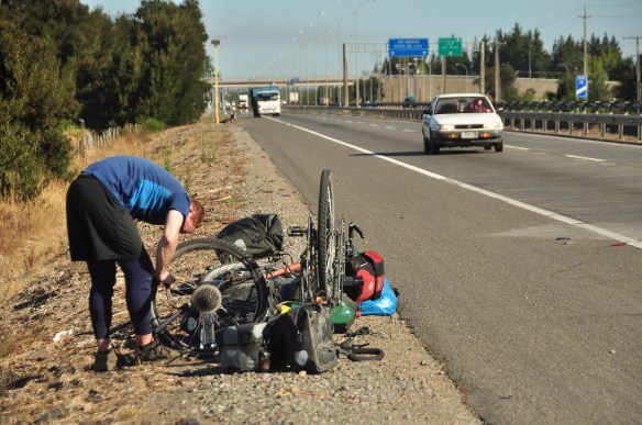 My second flat in 16,000km. The glass and wires all over the road caused us both to get one within two days.