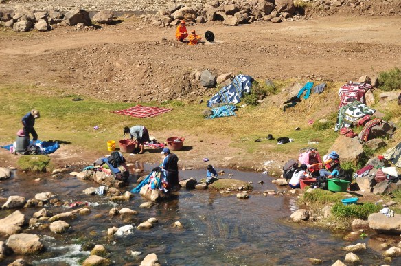 Laundry day! There were over a dozen people doing their laundry as we passed, with clothing, potatoes, and dead animal skins drying in the sun all around.