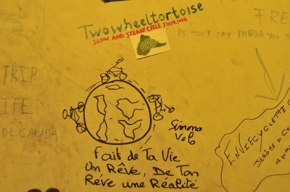 There are quotes, pictures, postcards, and cycling related things all over every wall.