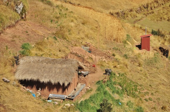 You can see the outhouse behind the house in this one.